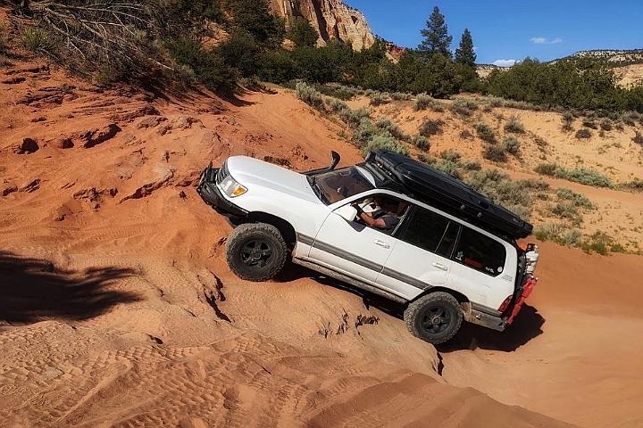 2000 Toyota Land Cruiser ICON suspension, SLEE rear bumper, sliders and battery trays, RedArc, Switch Pros, ARB air compressor, Doug Thorley headers & Cat-back exhaust, Dissent front bumper, skids & roofrack, ComeUp winch and A James Baroud RTT.